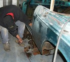 Jimmy prying fiberglass off rockers